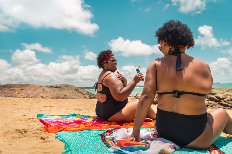 Rear view of afro women using suntan lotion at beach - stock photo
Women, Females, Sunbathing, Beach, Summer