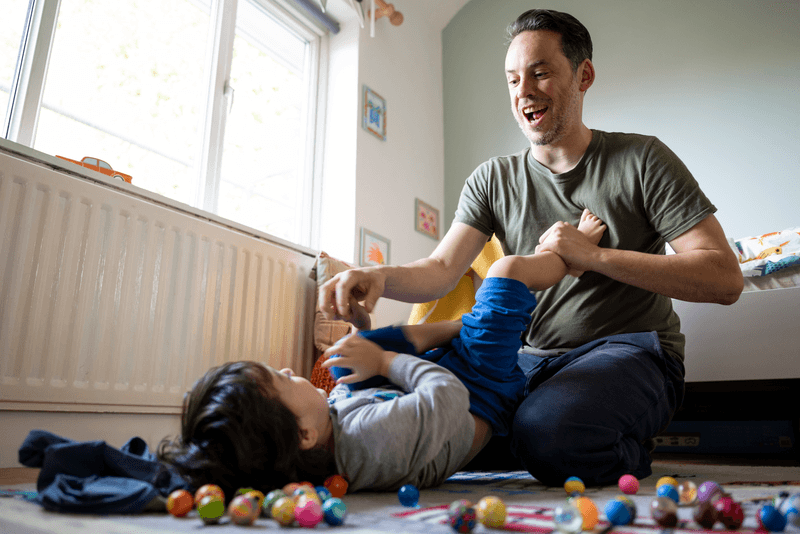 man playing with child