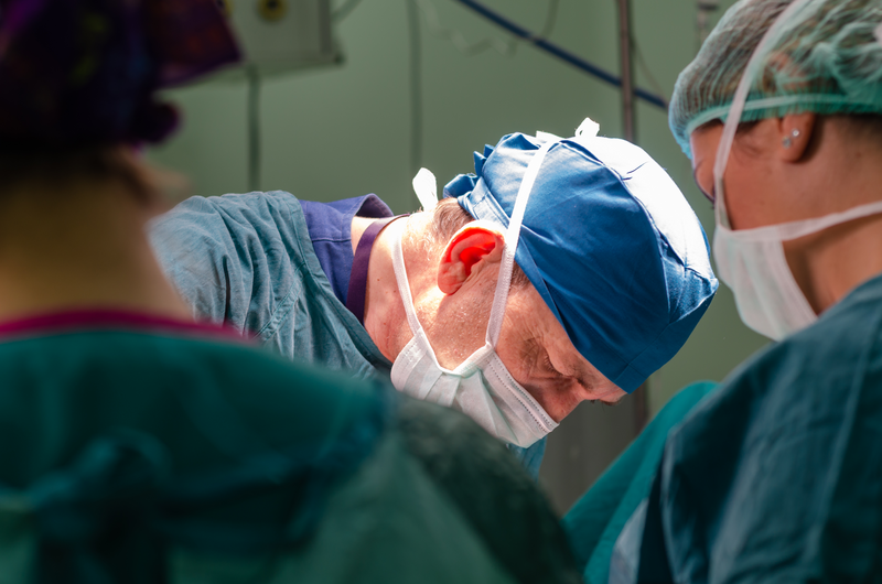 The surgeon is operating a patient - stock photo
Concentrated doctor and assistant during a hysterectomy operation in a hospital.Portrait of the surgeon doctor.